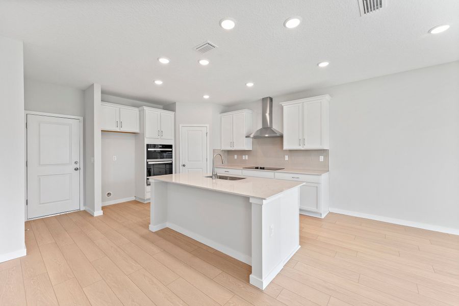 Lot 20 Ponderosa II Chef's Kitchen with Corner Pantry and Island at Camden Woods in Kingsland, GA