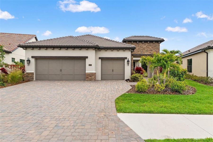Front exterior of a new home in , Nokomis, FL, highlighting curb appeal (Image 25). Front exterior of a new home in , Nokomis, FL, highlighting curb appeal (Image 25).