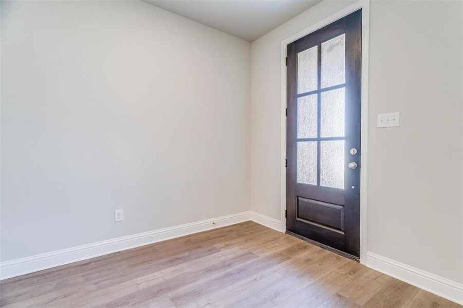 Foyer entrance with plenty of natural light and light hardwood / wood-style floors