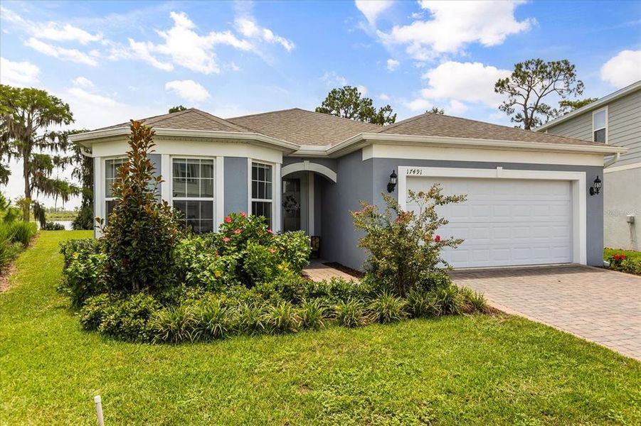 Front exterior of a new home in , Clermont, FL, highlighting curb appeal (Image 18). Front exterior of a new home in , Clermont, FL, highlighting curb appeal (Image 18).