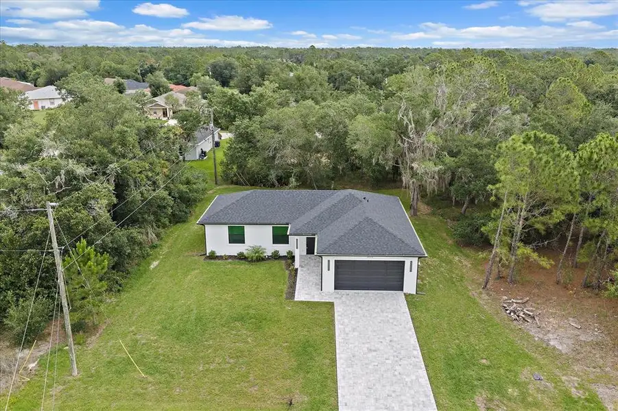 Front exterior of a new home in , North Port, FL, highlighting curb appeal (Image 2).