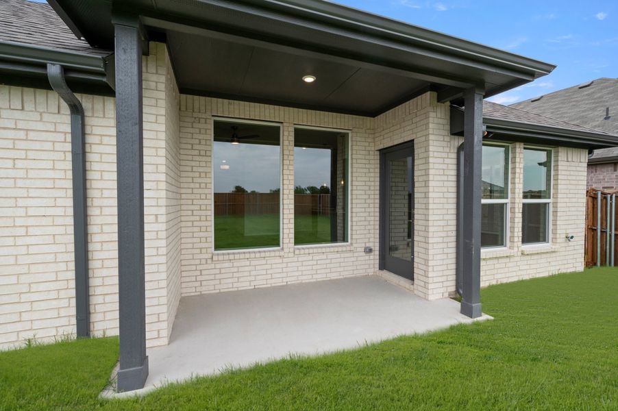 Exterior details and patio area of a home in Meadow Park at The Meadows, Ponder (Image 3).