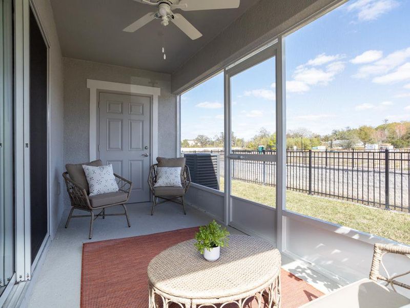 Your living and dining space extends outdoors to a private covered lanai - Magnolia townhome by Highland Homes