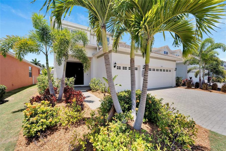 Front exterior of a new home in Marisol Pointe at MiraBay Florida Series, Apollo Beach, FL, highlighting curb appeal (Image 22).