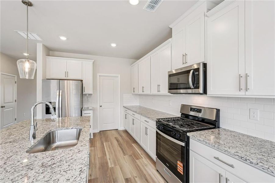 Furnished interior view inside a new home in Harmony Manor, Fairburn (Image 14).