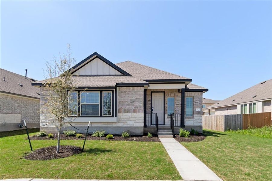 Front exterior of a new home in Saddle Creek, Georgetown, TX, highlighting curb appeal (Image 2).