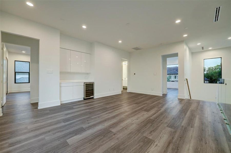 Hallway leading to another bedroom and access to the covered patio.