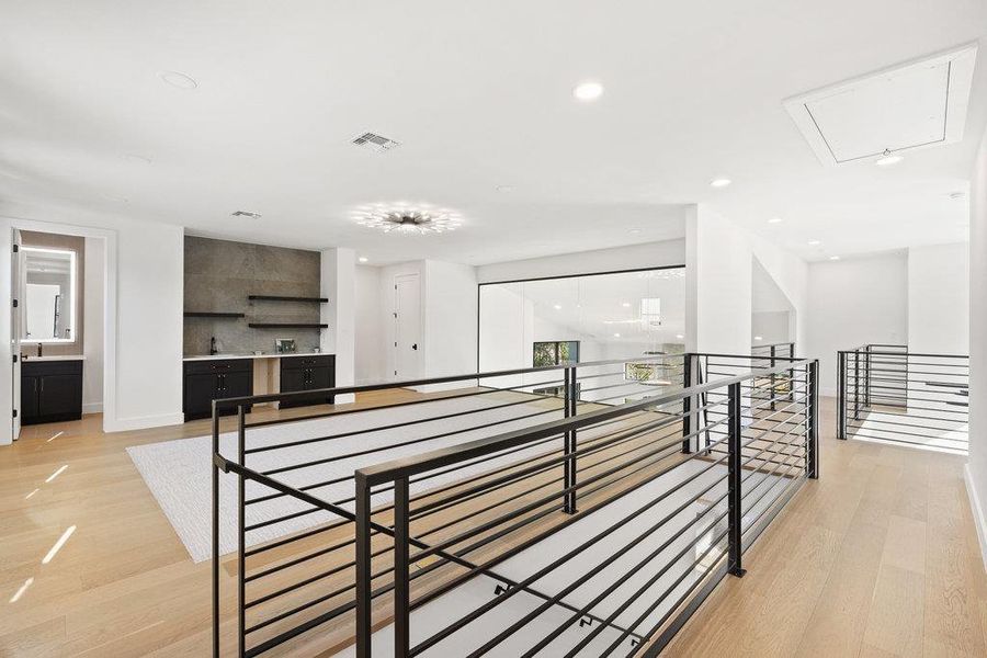 The second floor is a spectacular retreat with 3 additional bedrooms, 2.5 baths, and an oversized entertainer's game room and media lounge.