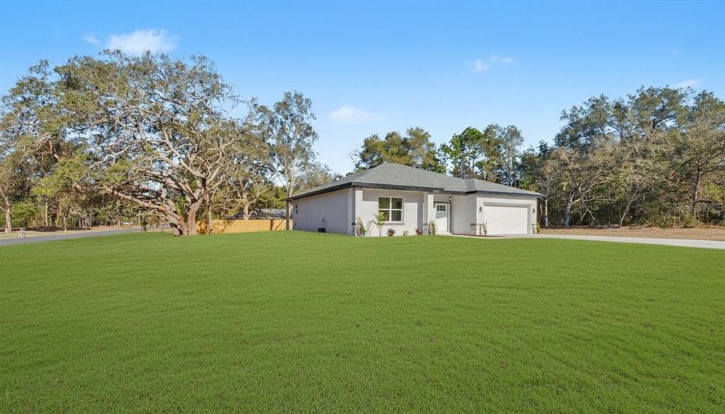 Front exterior of a new home in , Citrus Springs, FL, highlighting curb appeal (Image 22).