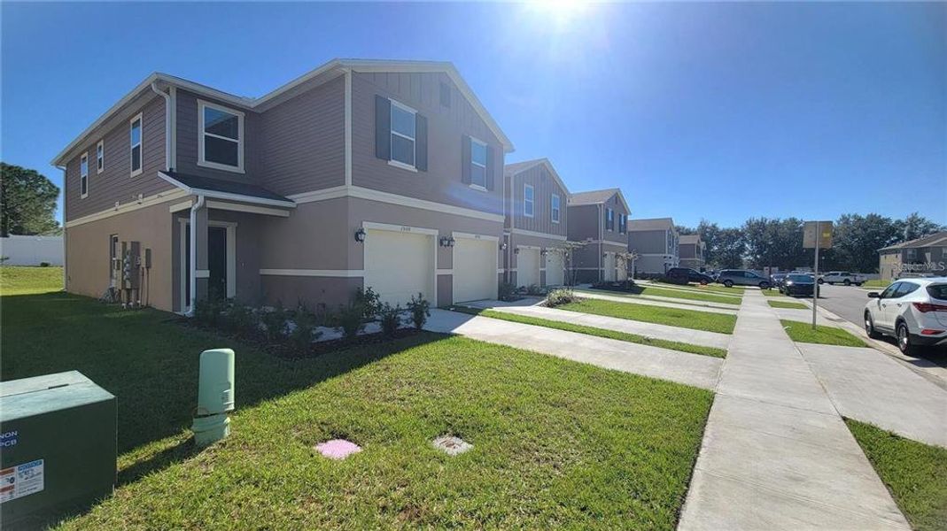 Front exterior of a new home in , Davenport, FL, highlighting curb appeal (Image 2). Front exterior of a new home in , Davenport, FL, highlighting curb appeal (Image 2).