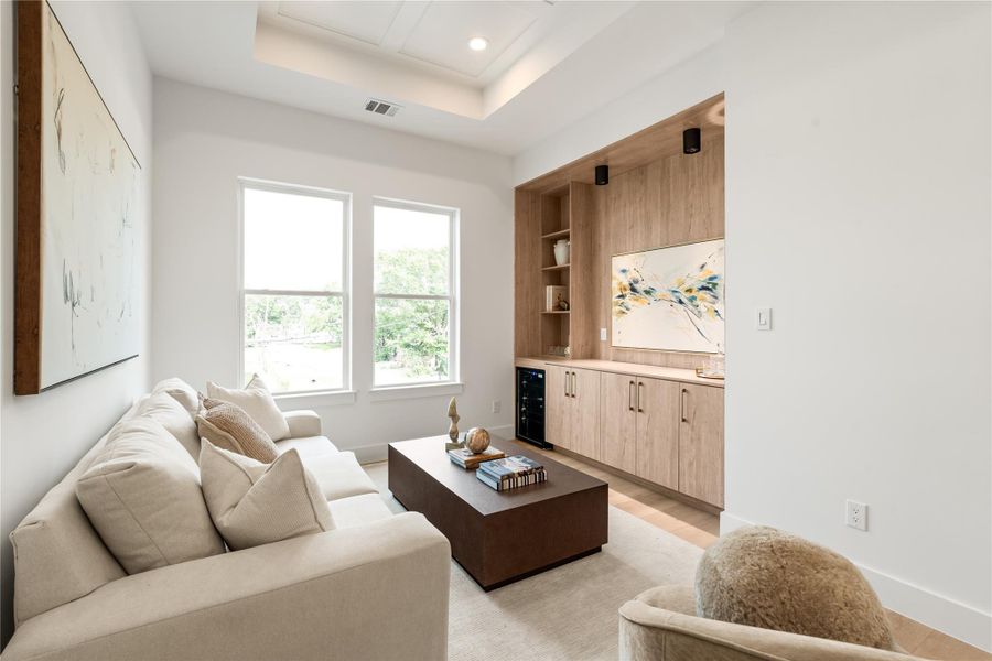 The custom built-in here offers real storage and display space without a single piece of furniture required to make the room work. It's a detail that quietly upgrades how this space can be used.