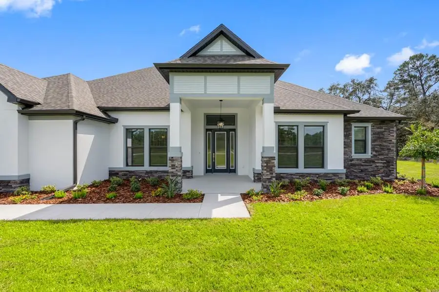 Front exterior of a new home in , Hudson, FL, highlighting curb appeal (Image 2). Front exterior of a new home in , Hudson, FL, highlighting curb appeal (Image 2).