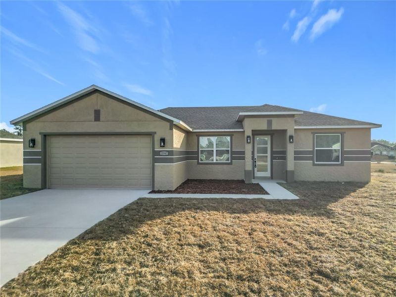 Front exterior of a new home in , Ocala, FL, highlighting curb appeal (Image 1). Front exterior of a new home in , Ocala, FL, highlighting curb appeal (Image 1).