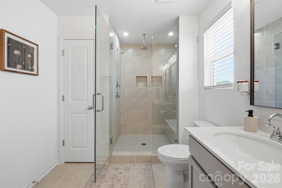 Primary bath with tiled, rainhead shower