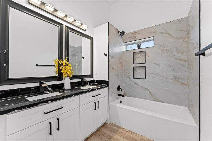 Beautifully designed bathrooms featuring modern fixtures and sleek design for a spa-like experience.