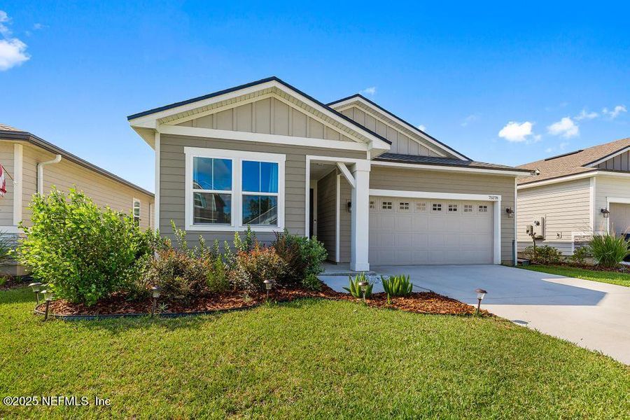 Front exterior of a new home in , Yulee, FL, highlighting curb appeal (Image 21). Front exterior of a new home in , Yulee, FL, highlighting curb appeal (Image 21).