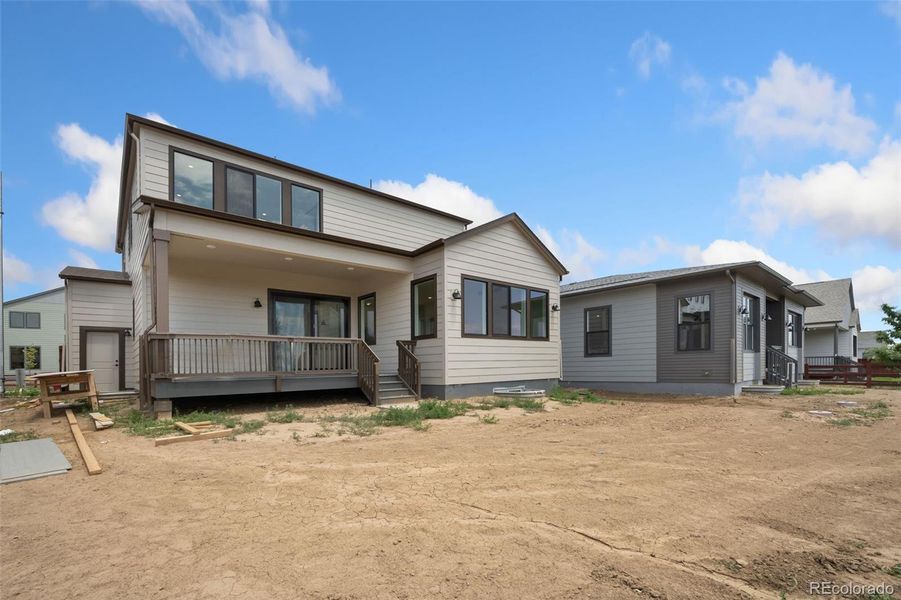 Front exterior of a new home in Festival at RainDance, Windsor, CO, highlighting curb appeal (Image 2).