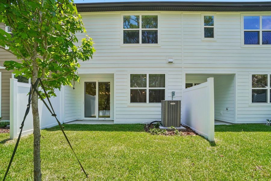 Beautiful backyard space with a covered lanai and privacy fence