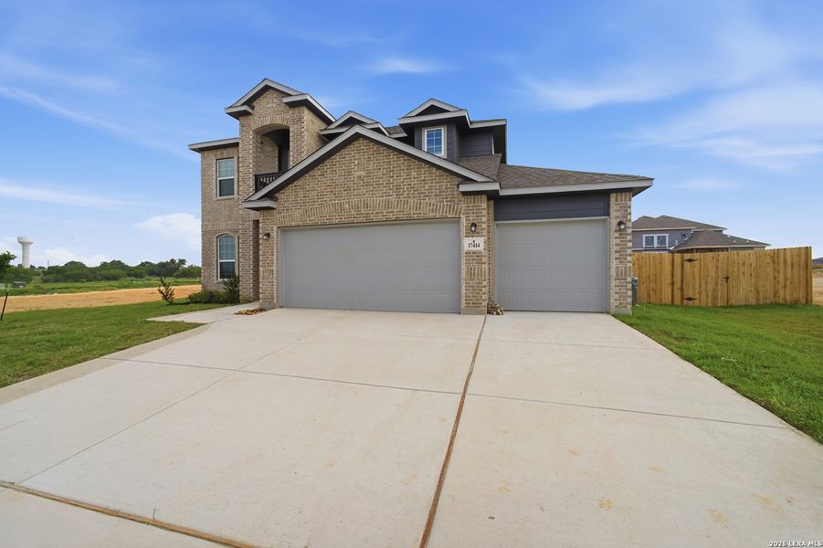 Front exterior of a new home in Hickory Ridge, Elmendorf, TX, highlighting curb appeal (Image 2).
