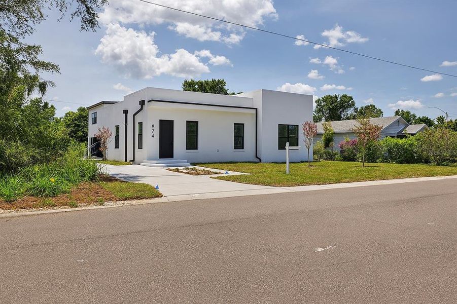 Front exterior of a new home in , St. Petersburg, FL, highlighting curb appeal (Image 23). Front exterior of a new home in , St. Petersburg, FL, highlighting curb appeal (Image 23).