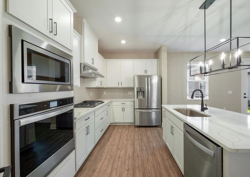 The kitchen includes gorgeous quartz countertops.