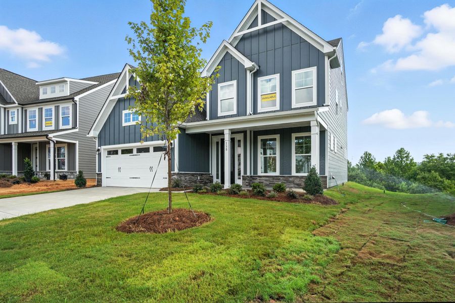 Front exterior of a new home in Summerlin, Mooresville, NC, highlighting curb appeal (Image 2). Front exterior of a new home in Summerlin, Mooresville, NC, highlighting curb appeal (Image 2).