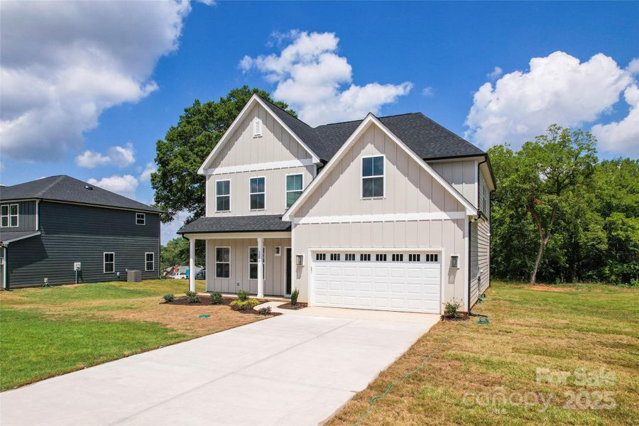 Front exterior of a new home in , Harrisburg, NC, highlighting curb appeal (Image 17).