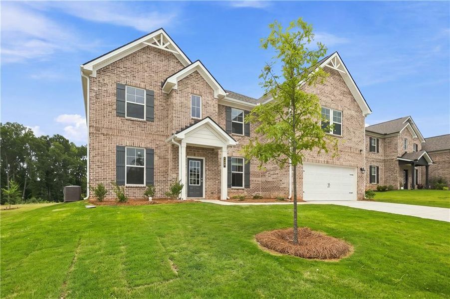 Front exterior of a new home in Westwind Estates, Hampton, GA, highlighting curb appeal (Image 23). Front exterior of a new home in Westwind Estates, Hampton, GA, highlighting curb appeal (Image 23).