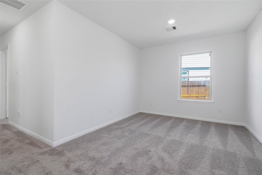 This handsome DEN features carpet flooring, high ceilings, large window, and custom paint!