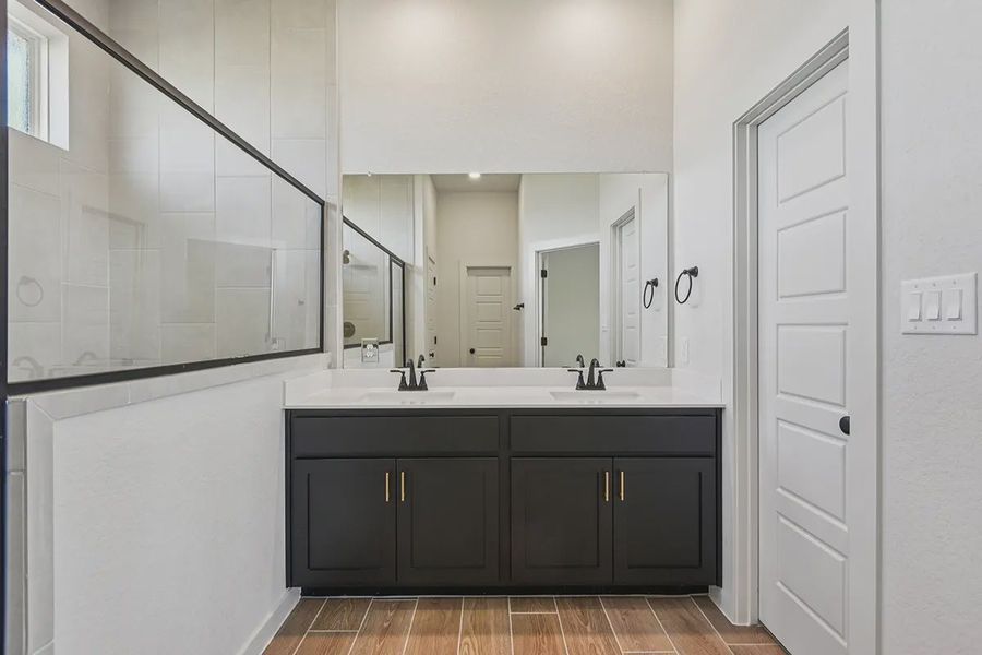 Representative furnished interior of a home built from the Rhyan by Chesmar Homes in Stream Waters, Seguin (Image 11).