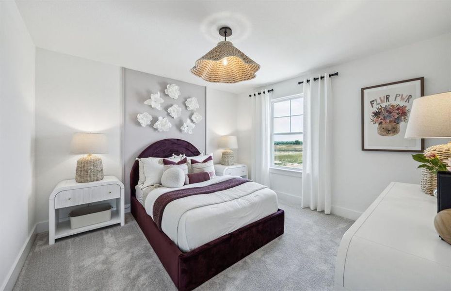 Secondary bedroom designed with generous storage solutions *Model representation