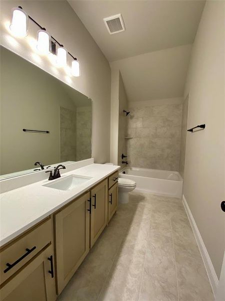 Bath 3 upstairs with quartz counters & 12x24 oversized tile.