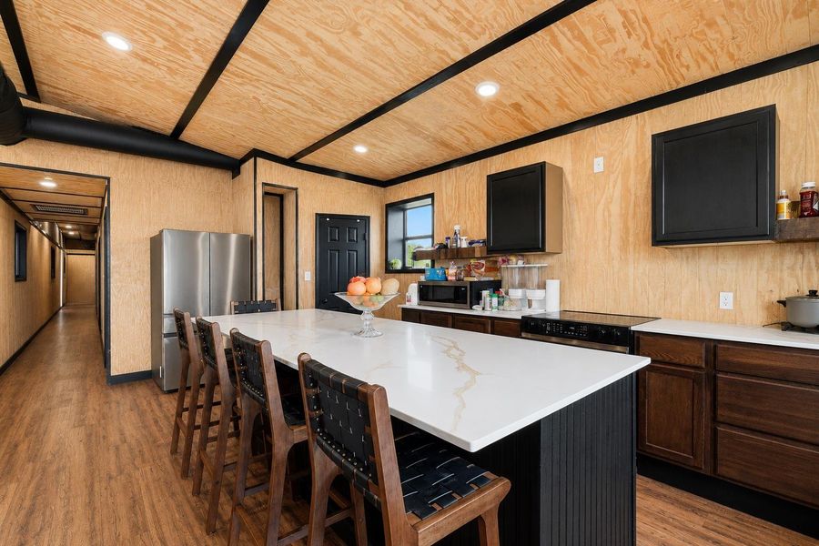 A well-appointed kitchen features a spacious island and modern appliances, perfect for entertaining.