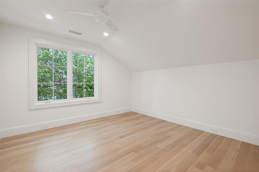 Third-floor bedroom with spacious layout and natural lighting. Third-floor bedroom with spacious layout and natural lighting.