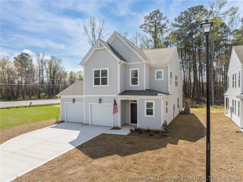 Front exterior of a new home in Pembroke, Hope Mills, NC, highlighting curb appeal (Image 18).