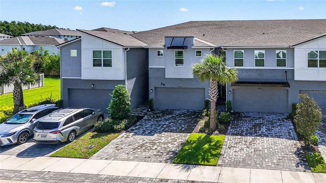 Front exterior of a new home in , Lutz, FL, highlighting curb appeal (Image 32).