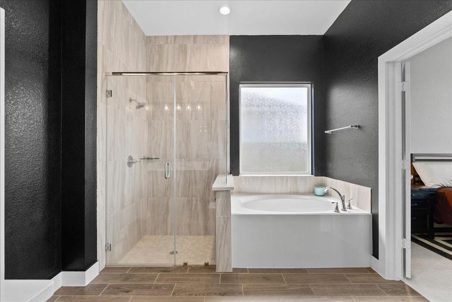 Unwind after a long day in the separate soaking tub while enjoying a beautifully designed bathroom that blends modern style with everyday functionality. Unwind after a long day in the separate soaking tub while enjoying a beautifully designed bathroom that blends modern style with everyday functionality.