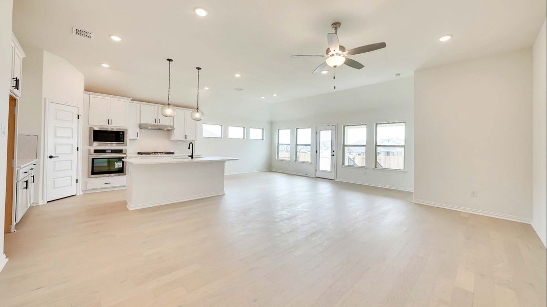 Representative furnished interior of a home built from the Palm by Brightland Homes in Sunterra, Katy (Image 5).