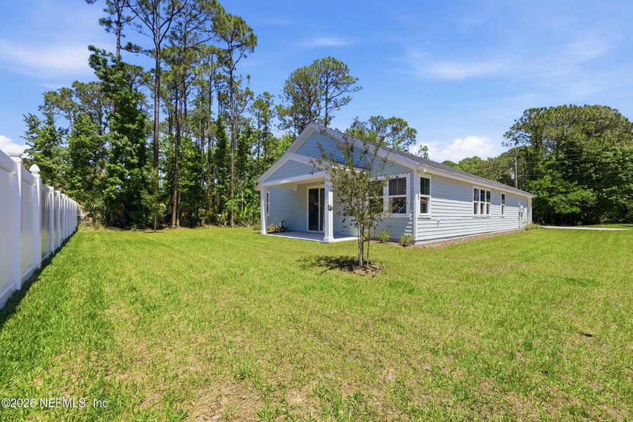 Exterior details and patio area of a home in Palm Coast Homes, Palm Coast (Image 4).
