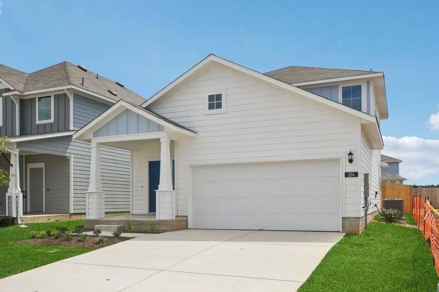 Front exterior of a new home in Cascade, Liberty Hill, TX, highlighting curb appeal (Image 2). Front exterior of a new home in Cascade, Liberty Hill, TX, highlighting curb appeal (Image 2).