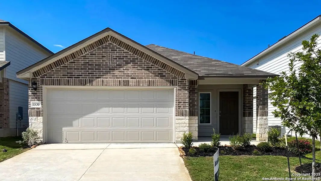 Front exterior of a new home in Winding Creek, New Braunfels, TX, highlighting curb appeal (Image 1). Front exterior of a new home in Winding Creek, New Braunfels, TX, highlighting curb appeal (Image 1).