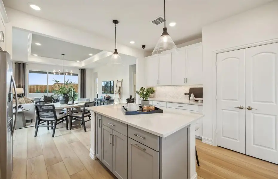 Large island overlooking gathering room and dining areas Large island overlooking gathering room and dining areas