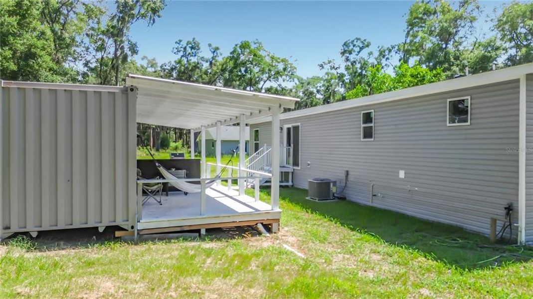 Exterior details and patio area of a home in , Summerfield (Image 29).