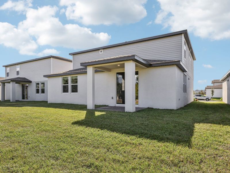 Exterior details and patio area of a home in The Meadow at Crossprairie, St. Cloud (Image 3).