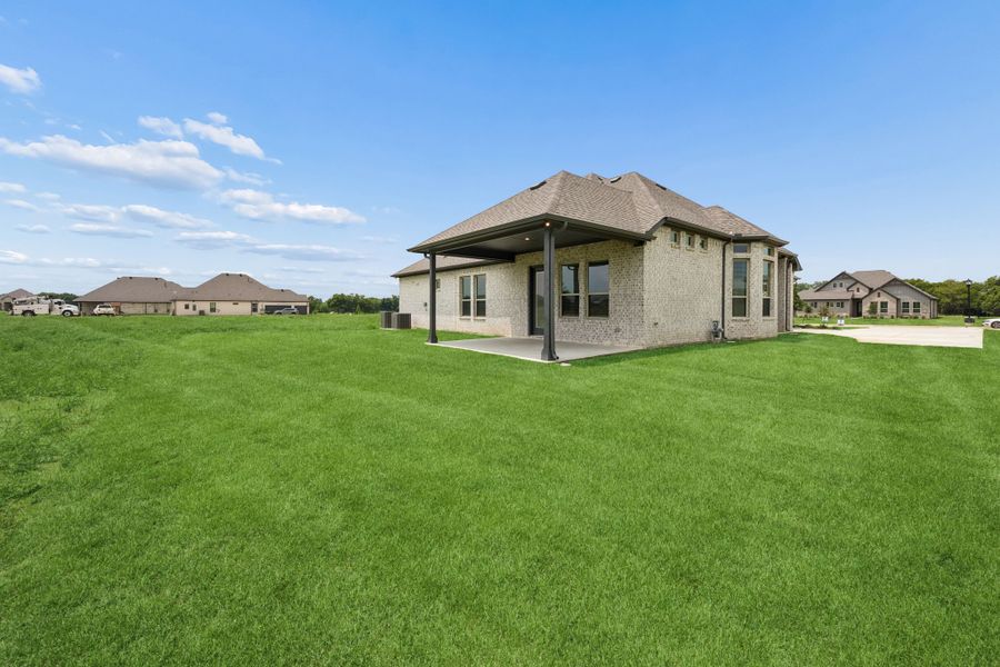 Exterior details and patio area of a home in Joshua Meadows, Joshua (Image 4).