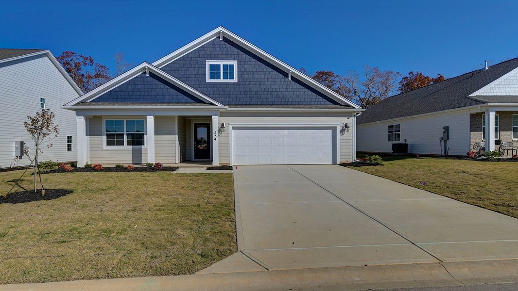 Front exterior of a new home in Livingston Woods, Irmo, SC, highlighting curb appeal (Image 2).