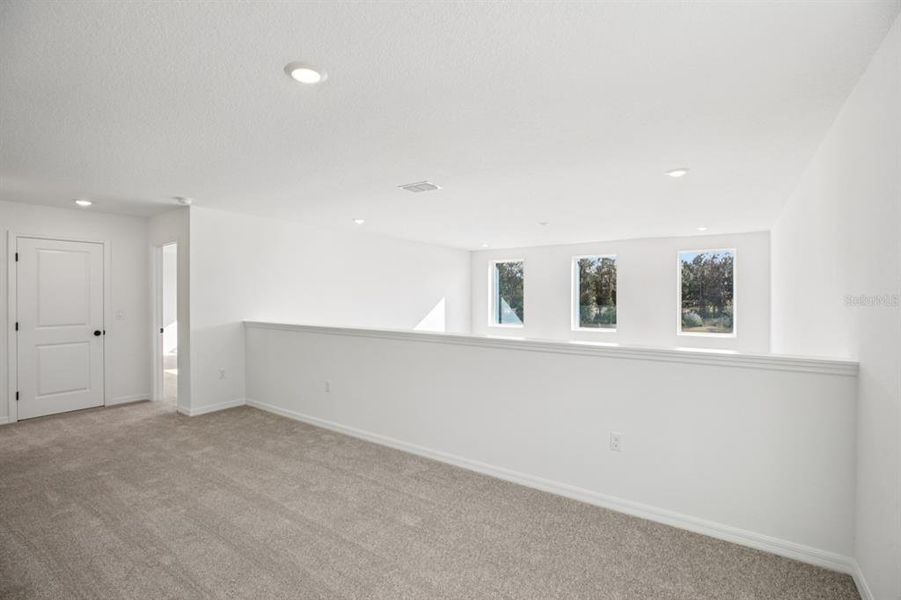 Spacious, unfurnished interior of a new home in Northlake at Ovation, Winter Garden (Image 19).