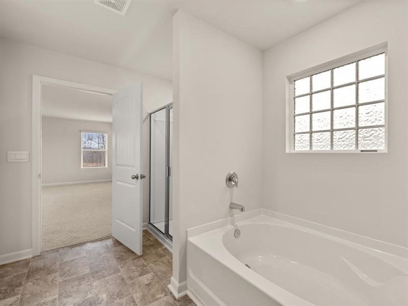 Furnished interior view inside a new home in Northwoods at Mirror Lake, Villa Rica (Image 15).