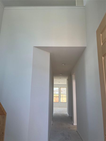 Hallway featuring baseboards