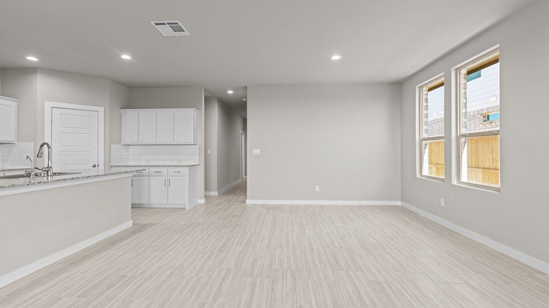 Representative unfurnished interior of a home built from the Jaxson by D.R. Horton in Legacy South, Midland (Image 12).